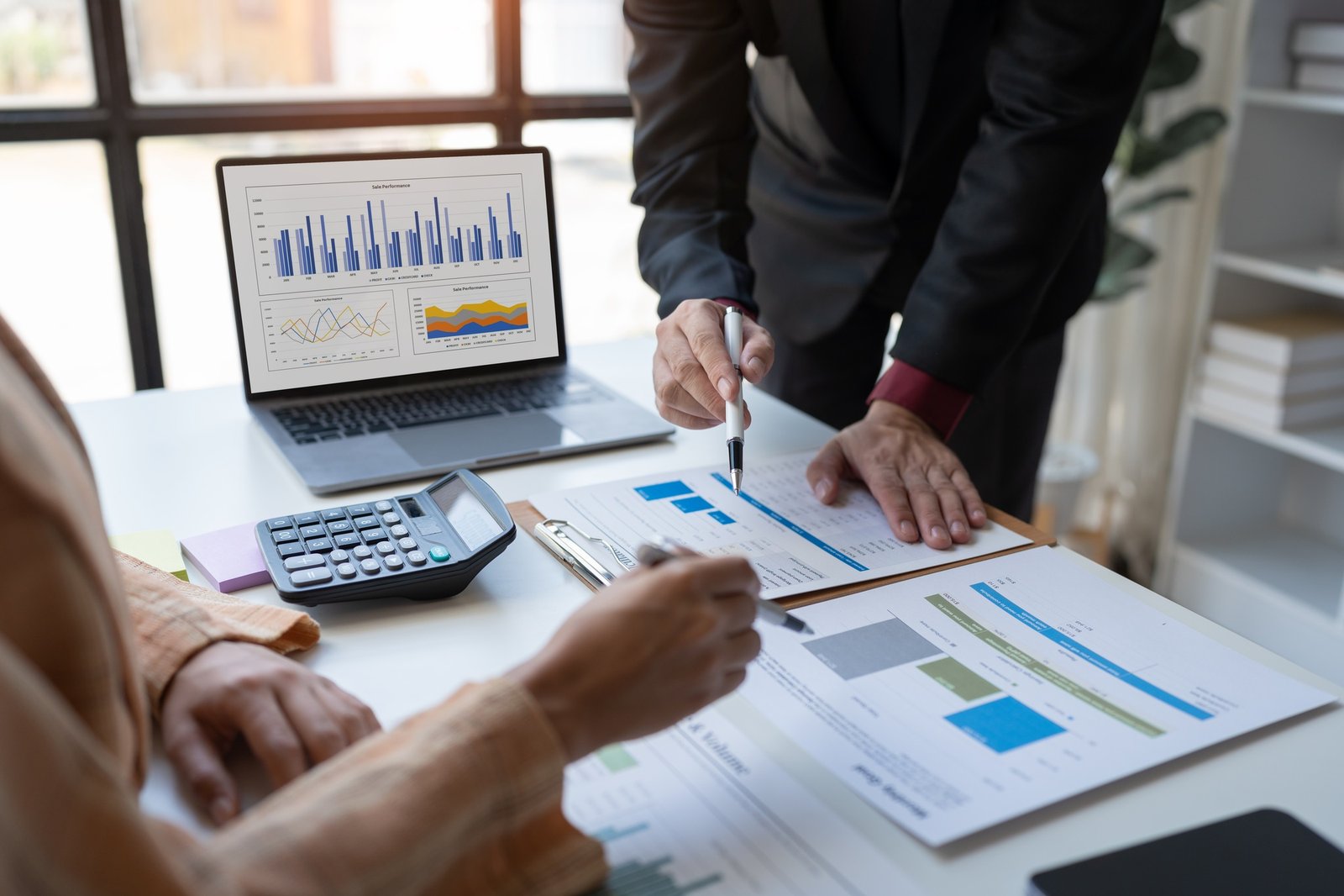 Business associates working and analyzing new projects in accounting, finance, investments, idea pre